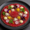 Carpaccio de Carne Madurada con Emulsión de Trufa Blanca y Tierra de Parmesano