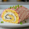 Brazo de Gitano Especiado con Frambuesas, Queso Crema y Miel de Ajo Negro