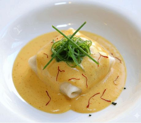 Ravioli de Mar con Salsa de Azafrán al Vermut